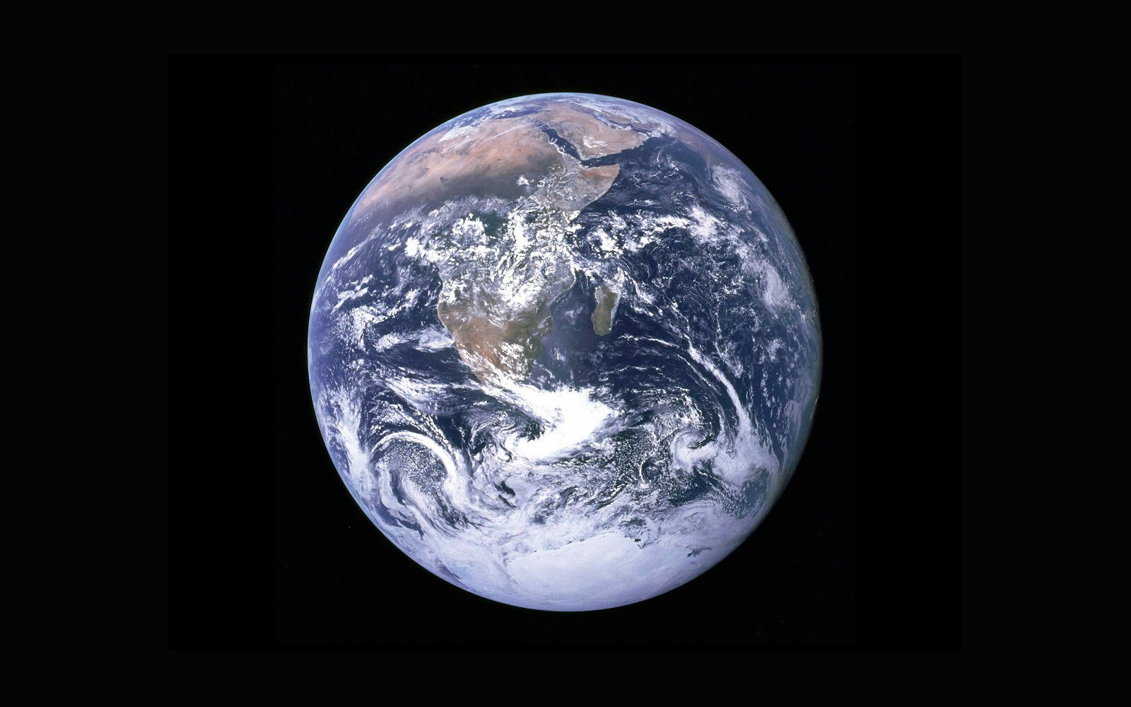 The Earth viewed from space against a black background.